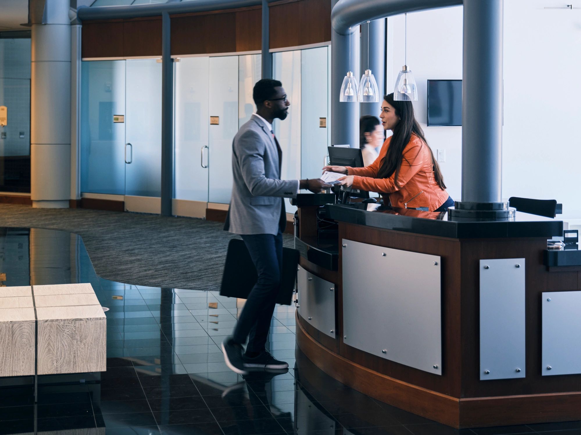 Customer service desk with staff assisting visitors