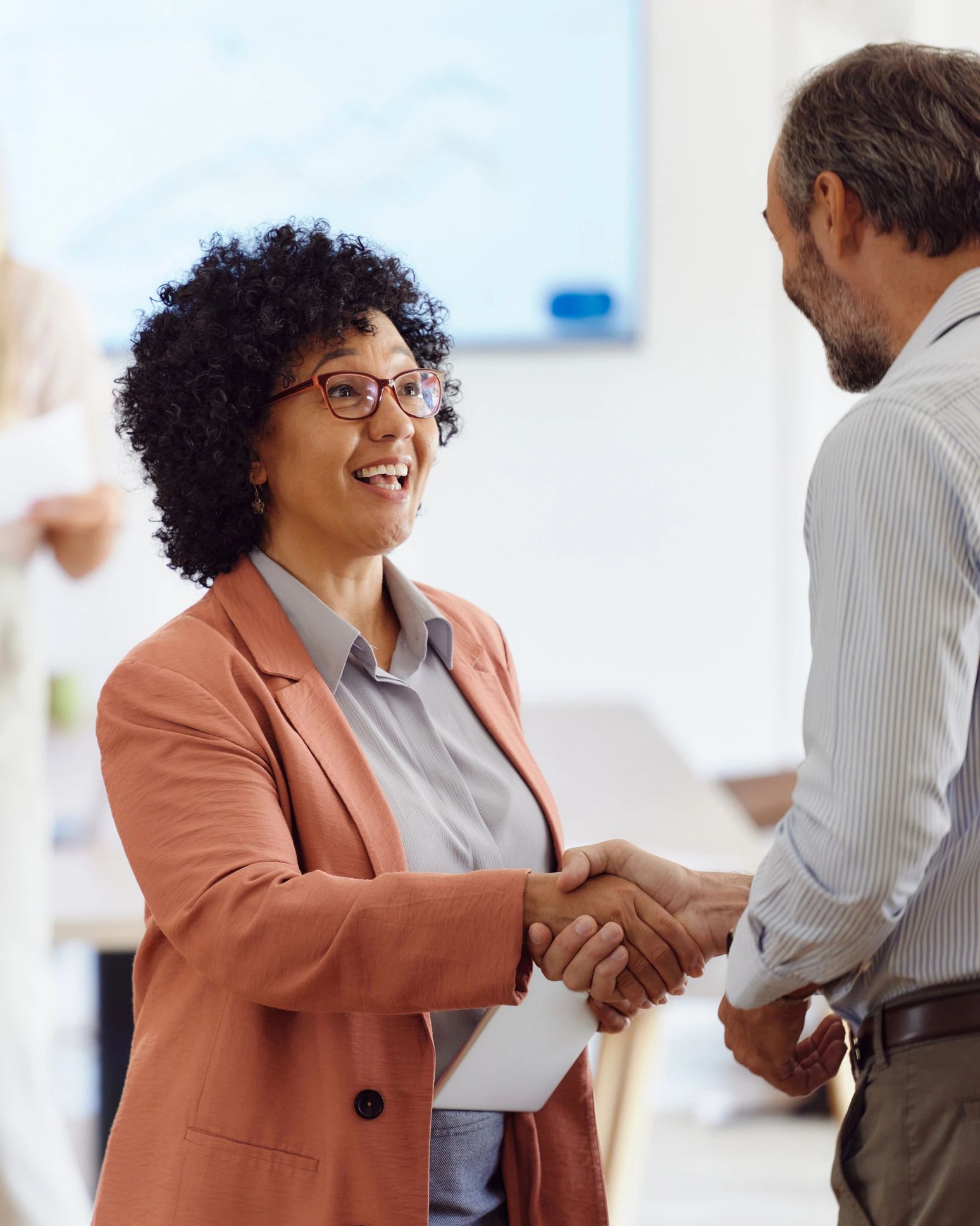 Two people shaking hands in agreement
