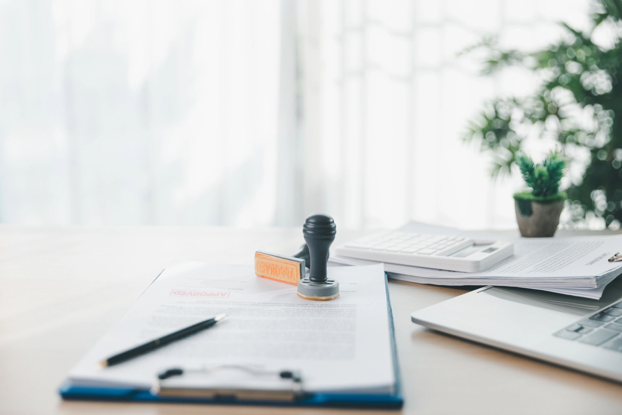 Approved stamp on paperwork representing verified public records